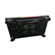 Black illuminous single folding portable caravan camping step with warning labels, isolated on a white background.