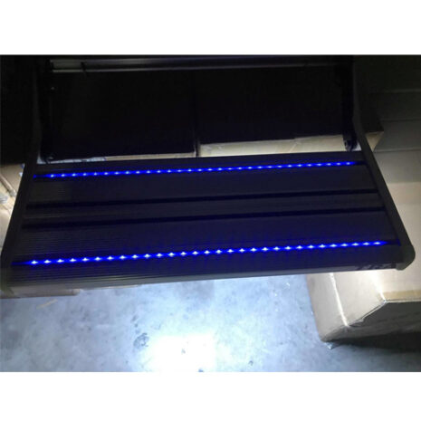 940848633 A BLACK Single 12v BLUE LED manual caravan rv motor home step in a garage.
